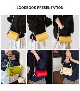 Detail view of colorful Boston bags with beaded charms and long shoulder straps