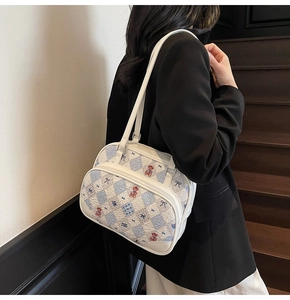 Close-up detail of cartoon pattern canvas tote bag with blue diamond lattice and bear print