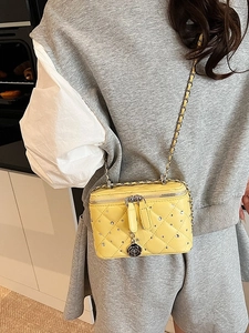 Bright yellow quilted crossbody box bag with rhinestones and camellia chain strap