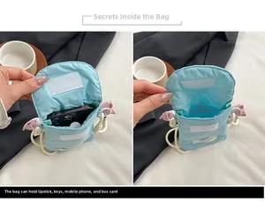 Detail view of light blue nylon phone bag with drawstring strap and internal compartment