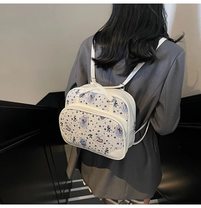 Detail showing the white cartoon bear pattern and soft synthetic leather texture on back