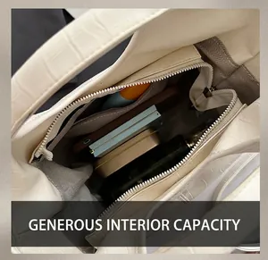 Detailed interior of white crocodile pattern bucket bag showing large capacity for essentials