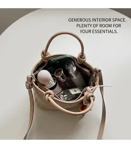 Detail view of woven bucket bag interior showing spacious room for perfume and cosmetics