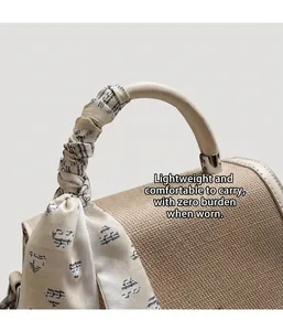 Detailed view of beige woven texture handbag with silk scarf wrapped handle detail