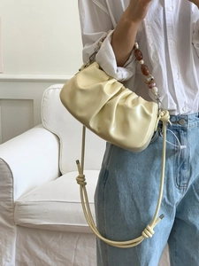 Chic pleated cloud bag in beige faux leather with marble bead handle and rope strap
