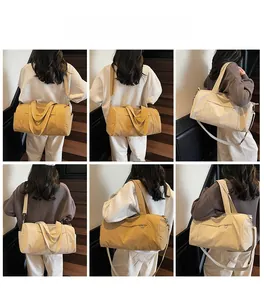 Close-up of a stylish khaki travel bag with reinforced handles and adjustable shoulder strap