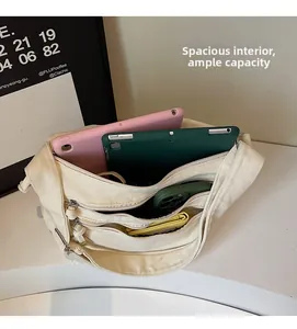 Detailed interior of the canvas tote bag showing multiple compartments and large capacity