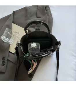 Top view of crocodile pattern bucket bag showing large internal capacity for essentials