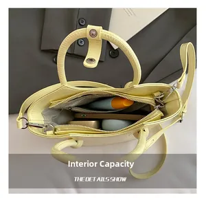 Detailed interior view of a yellow leather bucket bag showing large storage capacity