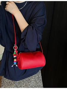 Mini red lychee texture cylinder crossbody bag with colorful alphabet charm
