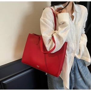 Red large capacity tote bag with MER PAI logo shown on person for style and scale