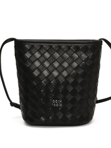 Minimalist black woven leather bucket bag with slim shoulder strap and metal logo
