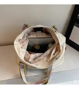 Interior view of large canvas tote bag showing spacious capacity with laptop and items