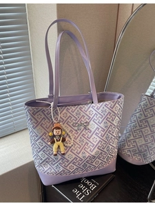 Lavender purple tote bag with geometric floral patterns and a cute character charm