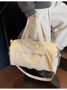 Versatile off-white travel duffel bag for women suitable for gym and short weekend trips