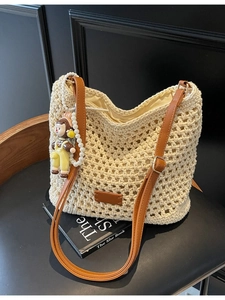 Women's Straw Woven Shoulder Bag Hollow Out Crochet Bucket Bag With Cartoon Doll Pendant Summer Beach Vacation Travel Handbag