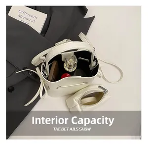 Internal view of a white drawstring bucket bag and mini pouch with storage capacity