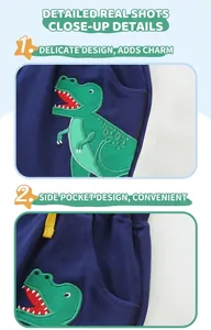 Détails de broderie dinosaure et cordon de serrage sur pantalon en coton bleu marine