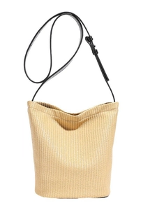 Minimalist woven bucket bag with adjustable black leather strap for summer beach vacation