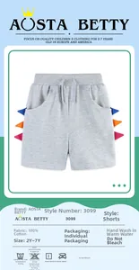 Detail view of cotton shorts for boys featuring colorful dinosaur tooth side trim details