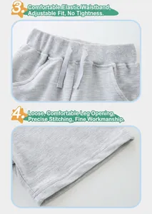 Detail of grey knit shorts showing elastic waistband with drawstring and fine stitching