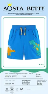 Detail of blue cotton knit shorts featuring embroidered dinosaur patches and yellow drawstring