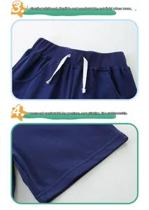 Detail of dark blue knit shorts featuring elastic drawstring waist and reinforced hem stitching