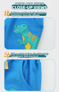 Detail of baby blue boy shorts showing dinosaur embroidery and elastic waist with drawcord