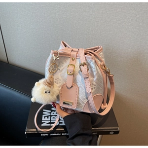 Detail of grey monogram bucket bag with pink leather trim and white sheep charm