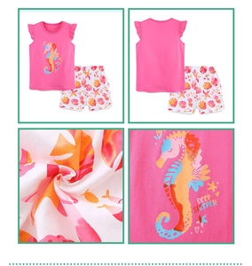 Detail view of girls' cotton sea horse print top and starfish pattern shorts set