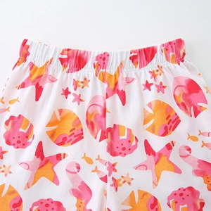 Girls summer two-piece outfit featuring elastic waist shorts with colorful starfish print