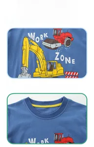 Detail of blue cotton t-shirt with excavator print and reinforced yellow neckband