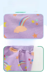 Detailed view of lilac kids shorts with rainbow print and functional side pockets
