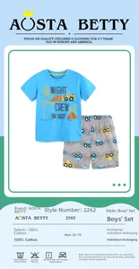 Detail view of cotton boy's summer set with blue tractor tee and printed gray shorts