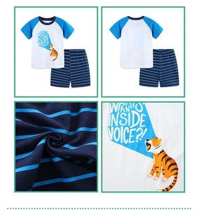 Detail of boys cotton t-shirt with tiger print and striped shorts loungewear set