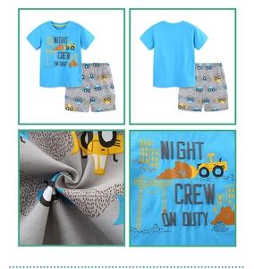Detail of kids cotton knit set featuring excavator print and blue car pattern shorts