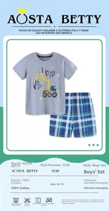 Detailed view of kids cotton t-shirt with excavator print and blue plaid shorts