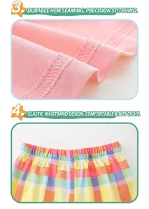 Dettaglio dell'orlo in cotone rosa con doppia cucitura e vita elastica con trama a quadri