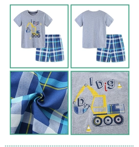 Detailed views of cotton kids' short sleeve set with excavator print and checkered shorts
