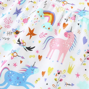 White cotton dress for girls featuring colorful cartoon unicorn and rainbow prints
