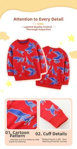Détail du sweat-shirt enfant rouge avec motifs baleines et poignets côtelés élastiques