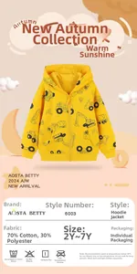 Detail view of cotton hoodie fabric showing vivid construction vehicle prints for boys