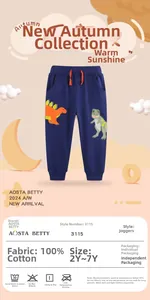 Detail of navy cotton boy joggers featuring orange and grey dinosaur embroidery with drawstring