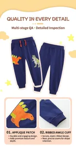 Detail of navy boy's joggers featuring dinosaur embroidery and ribbed elastic cuffs