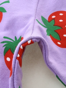Girls purple cotton sweatshirt featuring red strawberry print with detailed flat stitching