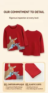 Detail view of elastic cuffs and cartoon deer print on girls red cotton t-shirt