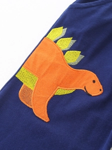 Boys navy knit cotton jogger pants featuring colorful embroidered dinosaur motif
