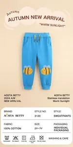 Detail of baby blue cotton joggers showing the bee embroidery and elastic drawstring waist