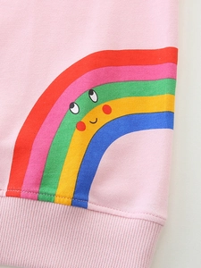 Pink girl's cotton sweatshirt featuring a vibrant rainbow print and ribbed hem detail