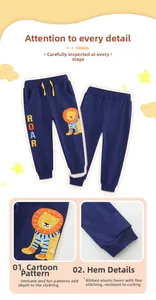 Detail of navy boy's cotton jogger showing yellow lion embroidery and ribbed cuffs